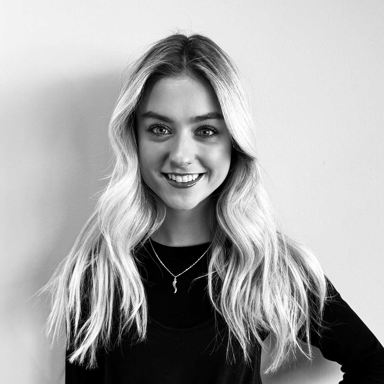 Portrait of Nikki, a professional stylist at Lux Salon, showcasing their expertise and style.